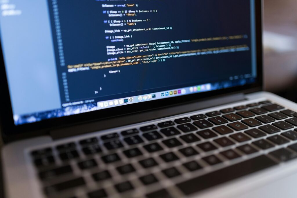pexels-photo-34600 Focused view of programming code displayed on a laptop, ideal for tech and coding themes.